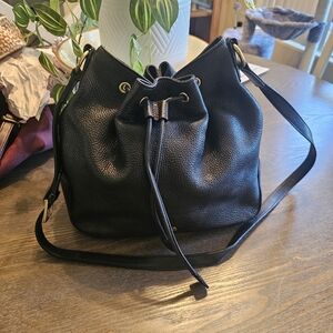 Etienne AIGNER BLACK PEBBLED LEATHER BUCKET BAG.